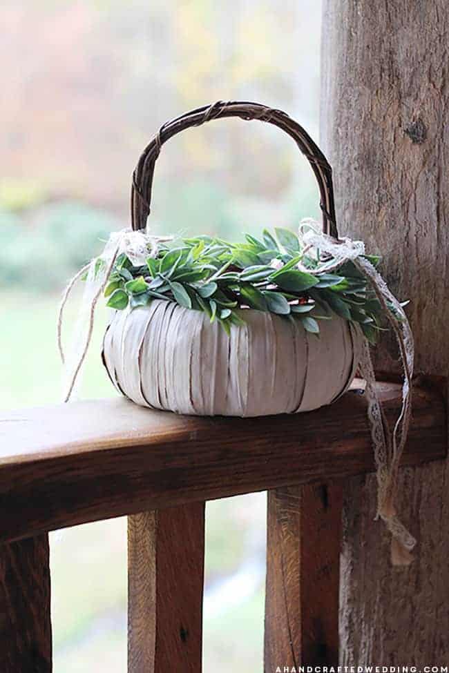 LOVE this idea for a fall wedding! Paint a pumpkin basket white, add twine and ribbon and use it for a flower girl basket. MountainModernLife.com
