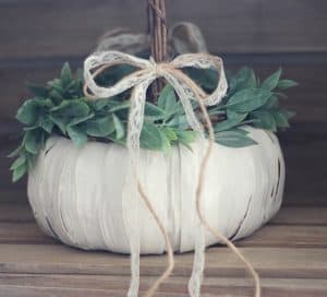 LOVE this idea for a fall wedding! Paint a pumpkin basket white, add twine and ribbon and use it for a flower girl basket. MountainModernLife.com