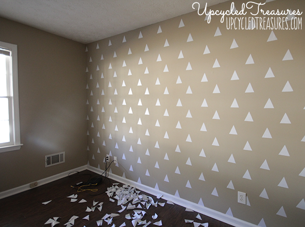 Looking to spruce up your walls in a rental property? Check out how to create a temporary DIY triangle accent wall for Less than $3! UpcycledTreasures.com