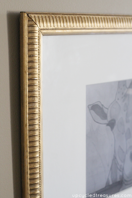 See how to update an old frame using gold Rub'n Buff. This is such an easy way to update an old {or new} art frame! 