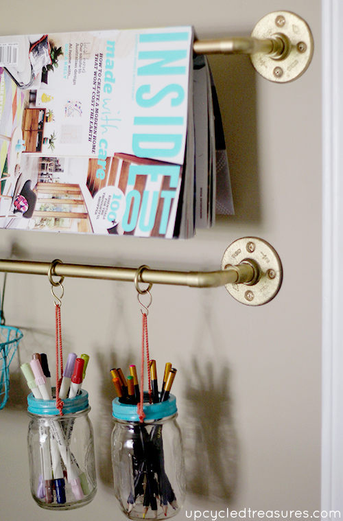 Get organized with this DIY Gold Pipe Hanging Storage which is perfect for storing items in a small space, craft room or kitchen!