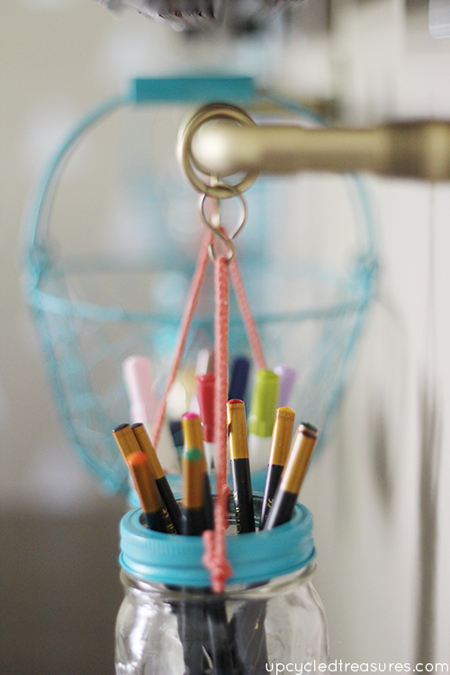 Get organized with this DIY Gold Pipe Hanging Storage which is perfect for storing items in a small space, craft room or kitchen!