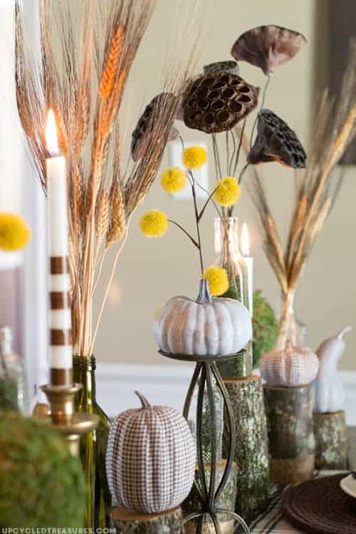 Budget-friendly dollar store fall decor with fall wreaths, autumn decorations, and stacked pumpkins for porch.