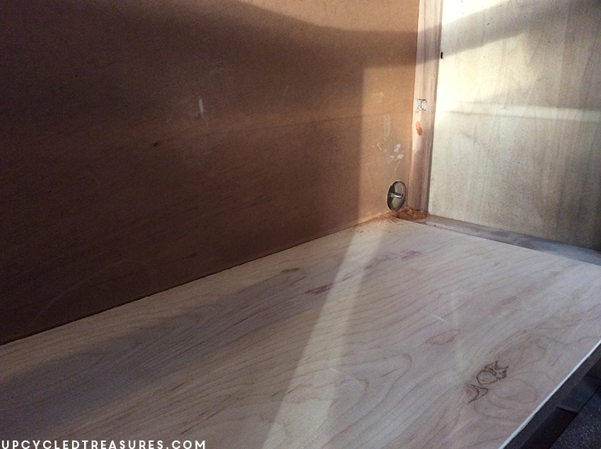 plywood-attached-to-armoire-to-replace-drawers-that-were-removed-and-using-hole-saw-drill-bit-upcycledtreasures