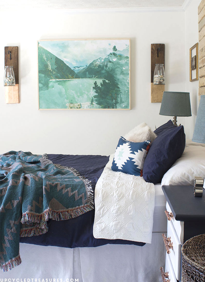 navy and white nightstands with copper pipe drawer pulls shown in bedroom. MountainModernlife.com