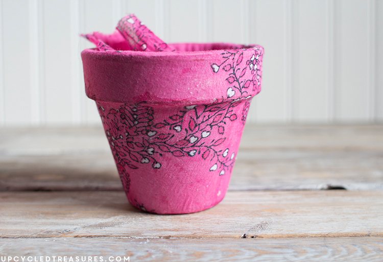 Old planter covered with pink flower designed scarf. MountainModernLife.com