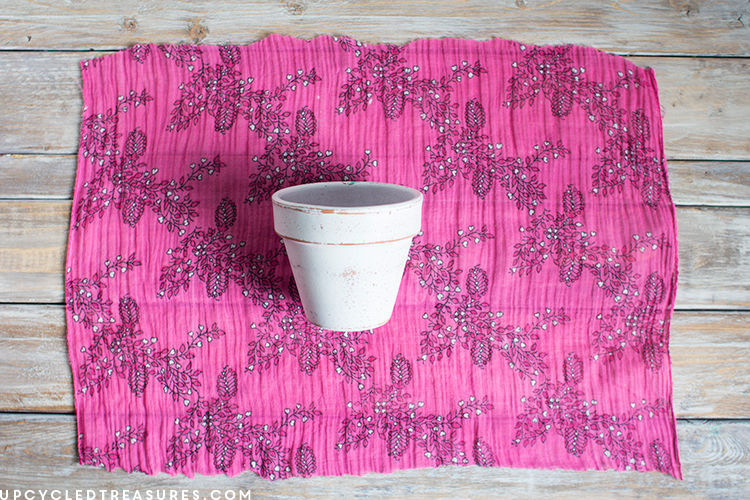Terra Cotta planter on top of pink scarf. MountainModernLife.com