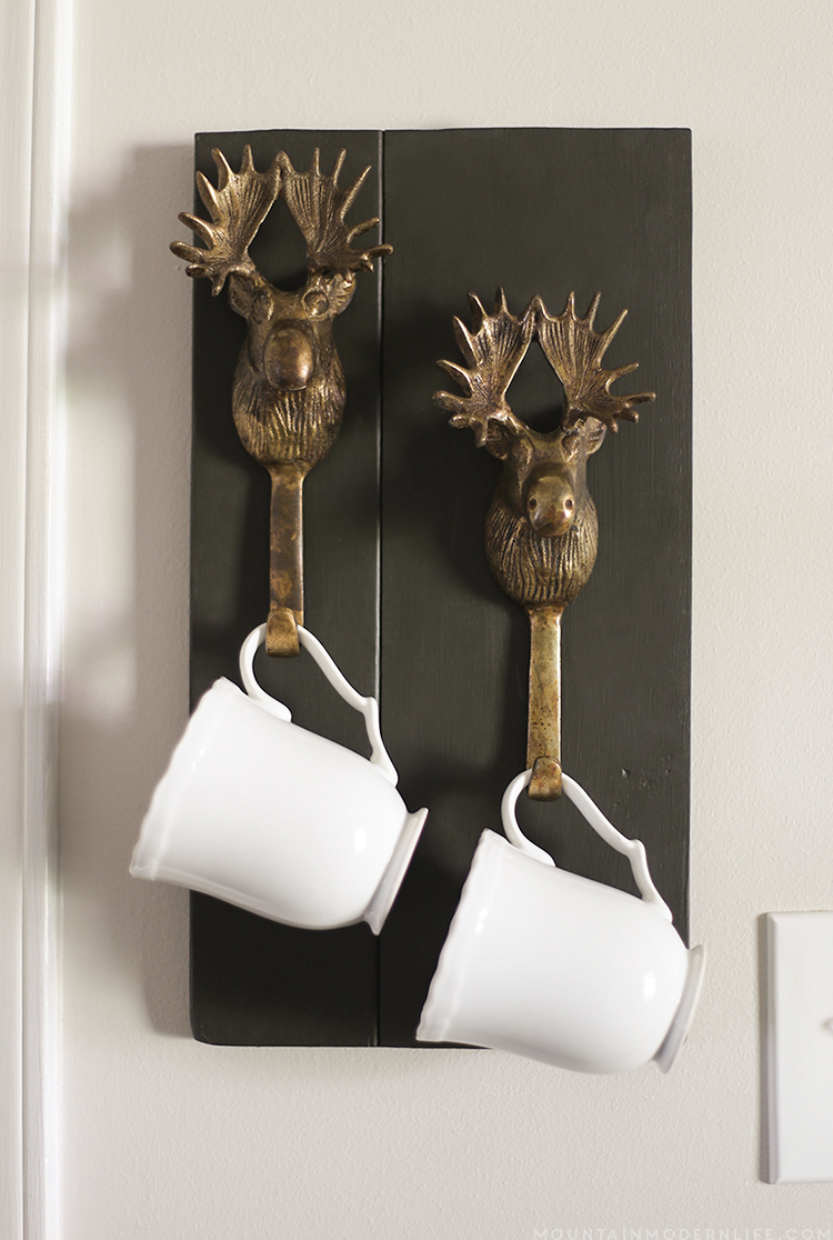 See how easy it is to make this rustic mug holder using moose hooks, perfect for a coffee bar! MountainModernLife.com