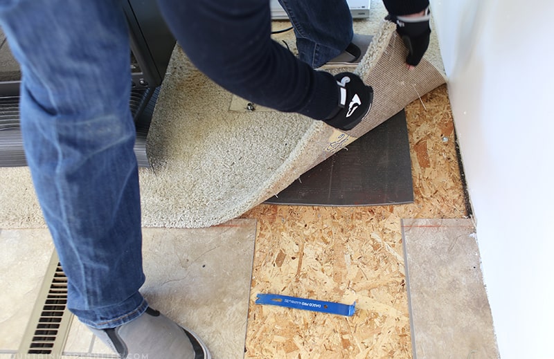 Removing the RV flooring around captain's chairs for new floor installation | MountainModernLife.com