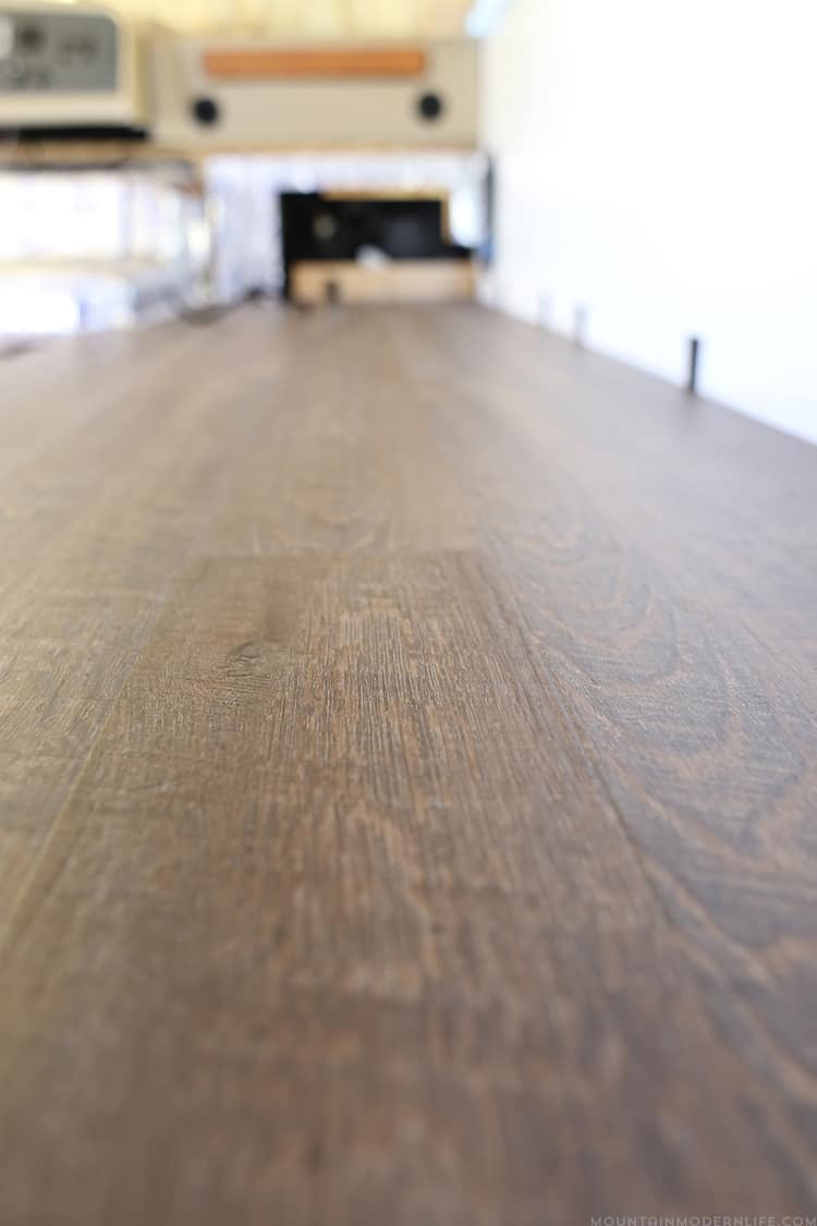 Are you looking to replace your RV flooring? Check out how we did just that in our motorhome to give it a more rustic modern vibe. | MountainModernLife.com