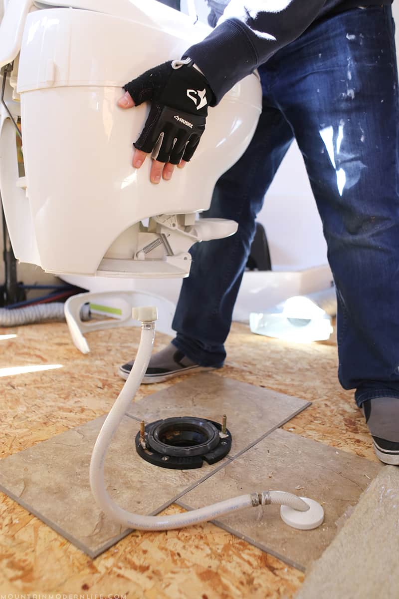 Removing the toilet in the RV before replacing the flooring | MountainModernLife.com