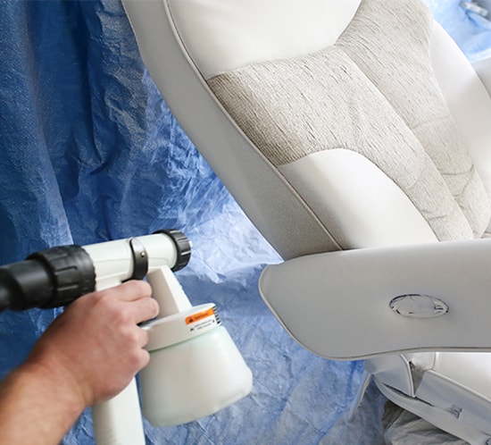 painting-rv-driver-chair-with-paint-sprayer-550x498-mountainmodernlife.com