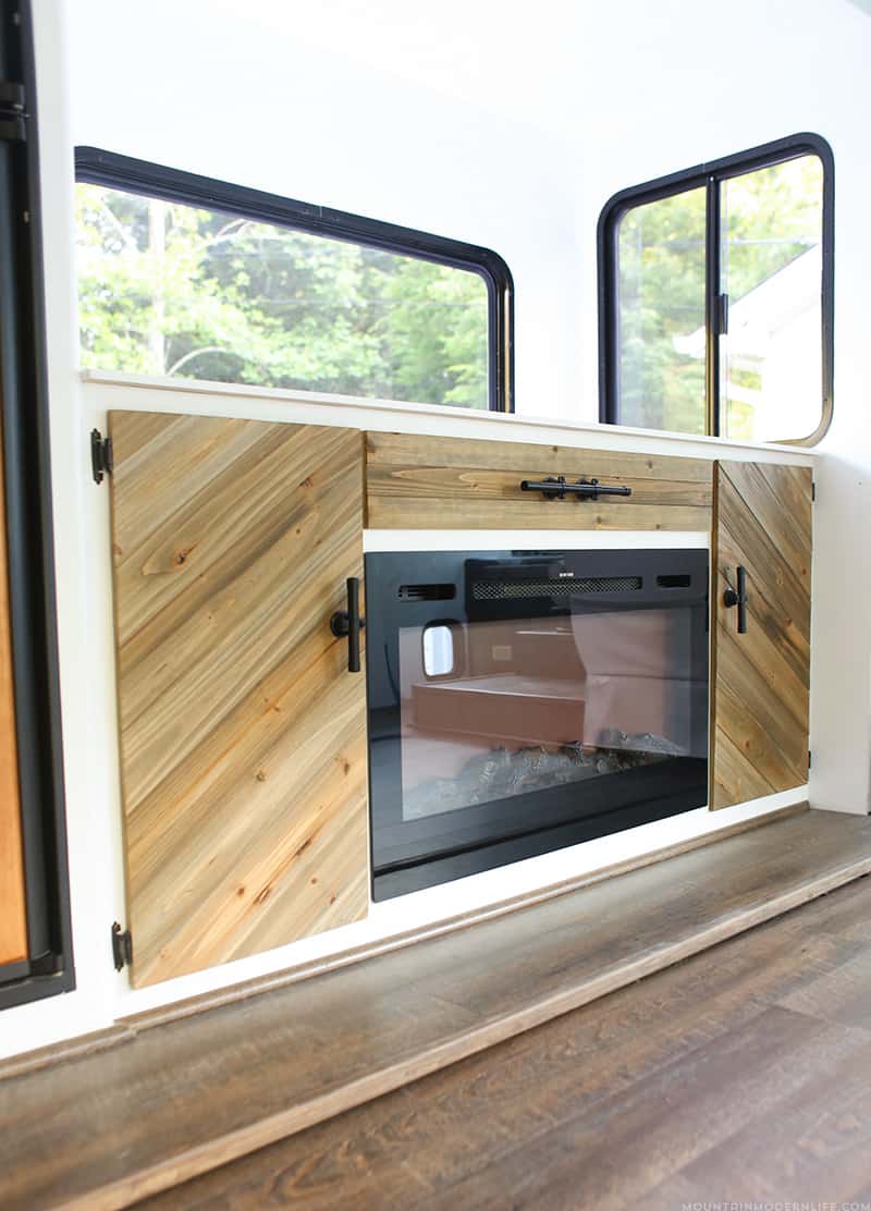 Looking for a creative way to hide your TV? Check out our rustic modern cabinet with TV lift and electric fireplace! MountainModernLife.com