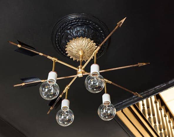 Thinking about making your own light fixture? You've gotta check out these DIY Modern Light Fixtures you won't believe are handmade! Photo: DIY Modern Brass Arrow Light Fixture from DesignSponge