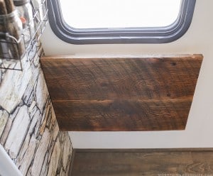 See how we added character and function to our RV by creating a wall-mounted desk from reclaimed wood. MountainModernLife.com
