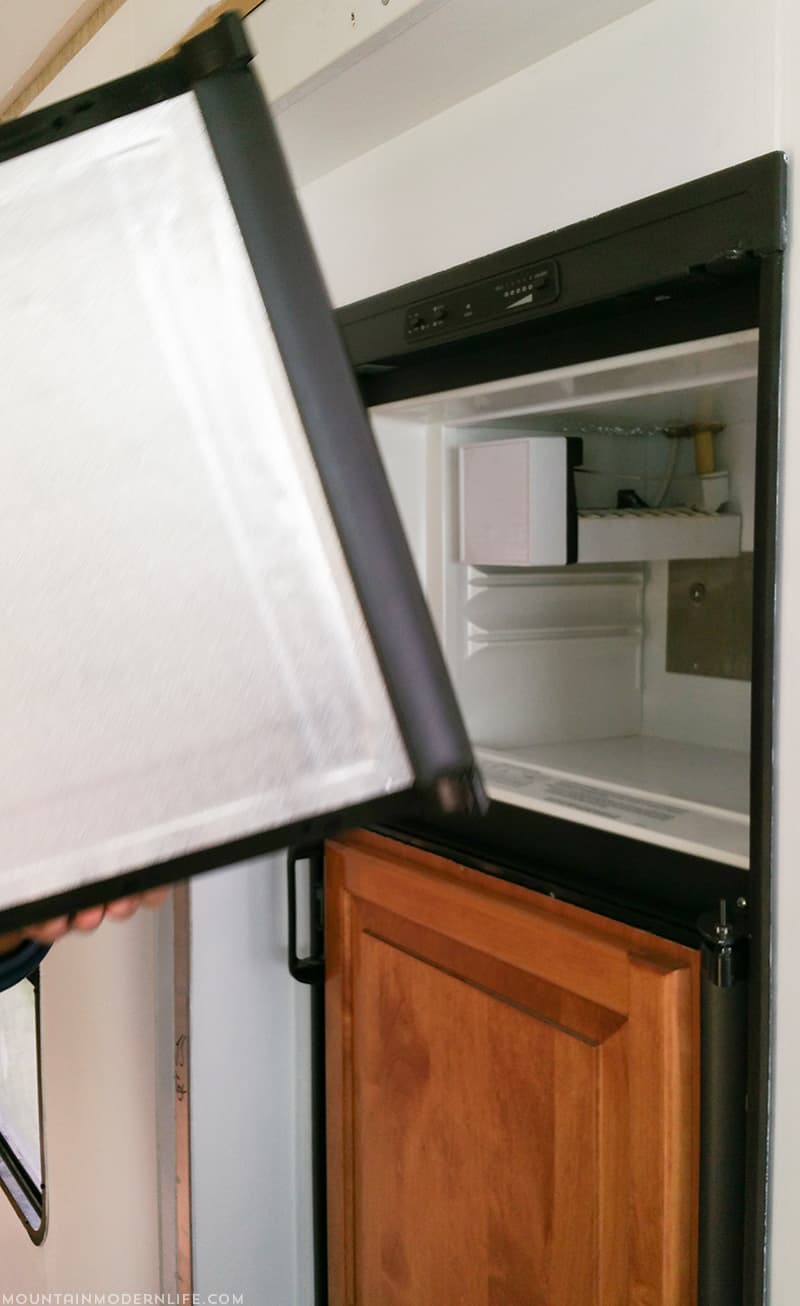 Looking for easy ways to update your RV or camper? See how you can turn your RV fridge into a magnetic dry erase board! MountainModernLife.com