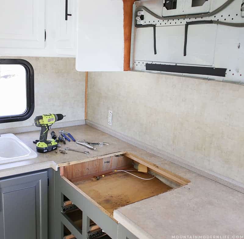 See how easy it is to remove your RV Kitchen Stove, in case you need to set it aside, clean it or replace it. MountainModernLife.com
