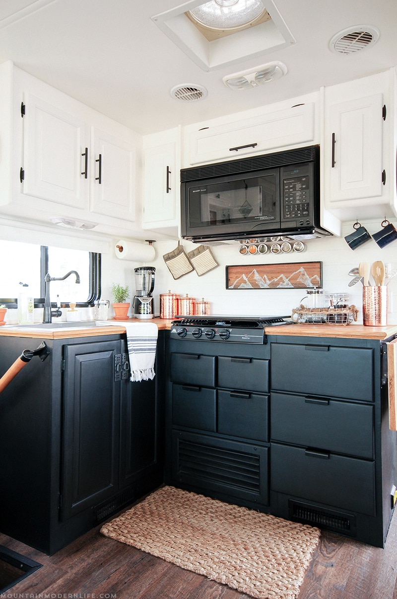 Come see how we painted our two-toned RV kitchen cabinets, and skip the mistakes I made along the way! MountainModernLife.com