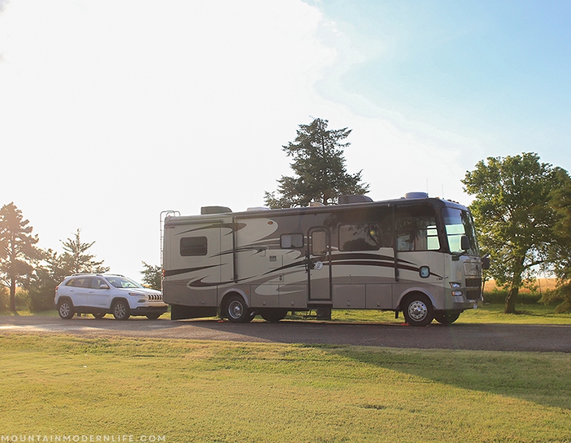 Our RV in front of the car at the Kansas rest stop | Mountainmodernlife.com
