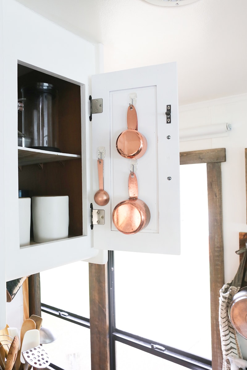 Looking for ways to maximize the space in your RV? Here are some tips for Organizing a Tiny Kitchen! MountainModernLife.com
