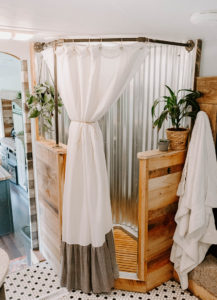 rustic rv bathroom with galvanized metal in shower