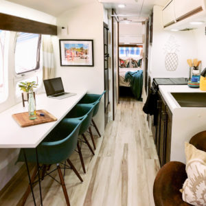 Tour this Renovated Airstream from Trailer Trashin' with Modern Finishes and Tropical Vibes! Featured on MountainModernLife.com