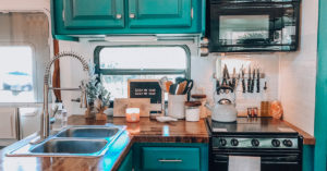 Tour this renovated camper that was transformed by a couple with a passion for international travel! // Photos by ems_traveldiary // Featured on MountainModernLife.com