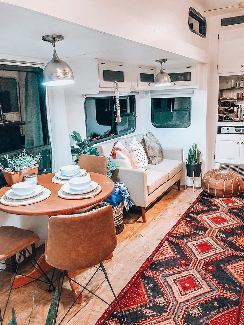 See how a passion for international travel influenced the interior design of this camper renovation! / Photos by @ems_traveldiary / Featured on MountainModernLife.com #camperrenovation