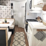 Tour this budget-friendly farmhouse camper that was transformed for $500 by Proverbs31Girl! Featured on MountainModernLife.com