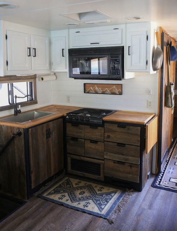 Remodeled-rv-kitchen-black-counters-reclaimed-cabinets ...