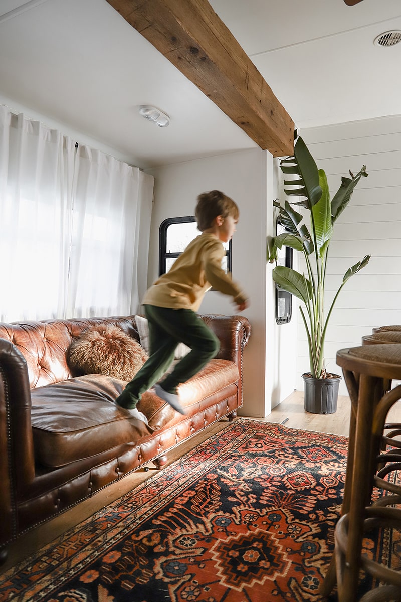 Tour this modern RV renovation with old world charm from @r.maria.fuller that has wood beams that will make you swoon! See the before and after on MountainModernLife.com