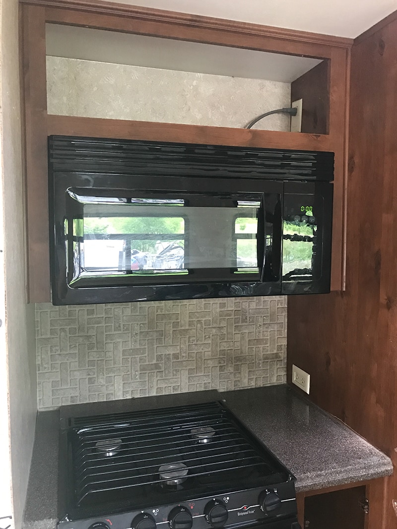 Tour this modern RV with old world charm from @r.maria.fuller that has wood beams that will make you swoon! See the before and after on MountainModernLife.com