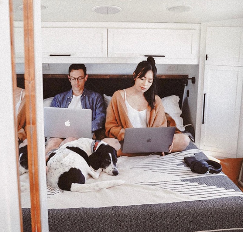 See how these digital nomads created a modern yet cozy RV that allows then to work on the road! Photo by Detach and Roam - Featured on MountainModernLife.com