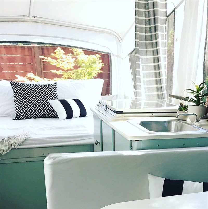 This pop-up camper makeover is bright, airy, and ready for summer! Photo from Rice Camp Blog | Featured on MountainModernLife.com 