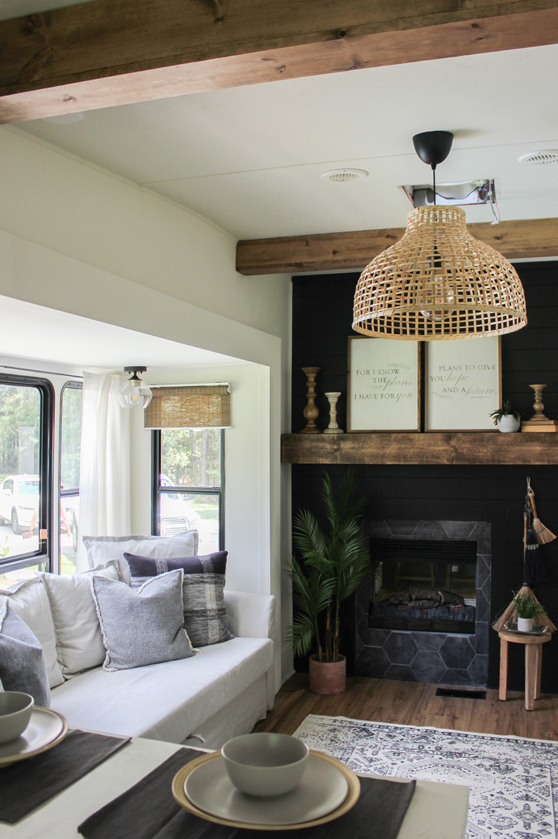 This remodeled RV has the coziest fireplace you've ever seen in a tiny home (and it's for sale!). Featuring @karleemmarsh on MountainModernLife.com