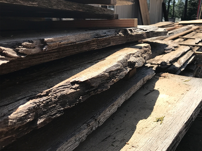 Stack of reclaimed wood air drying | MountainModernLife.com