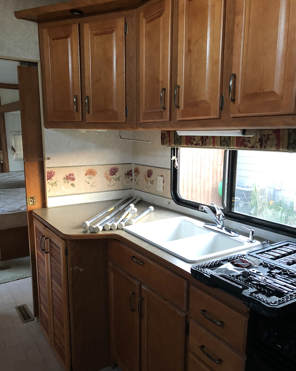Outdated RV Kitchen before reno from from @fifthwheelfarmhouse