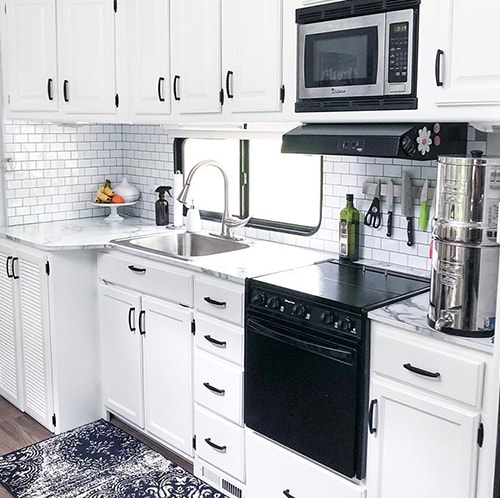 See how a white and gray interior transformed this remodeled 5th wheel!
