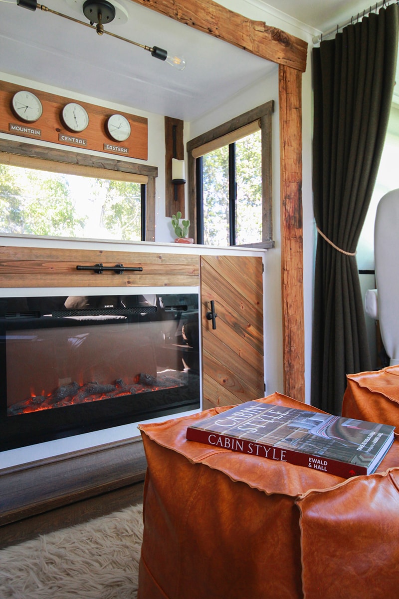 The book Cabin Style on faux leather ottoman inside RV