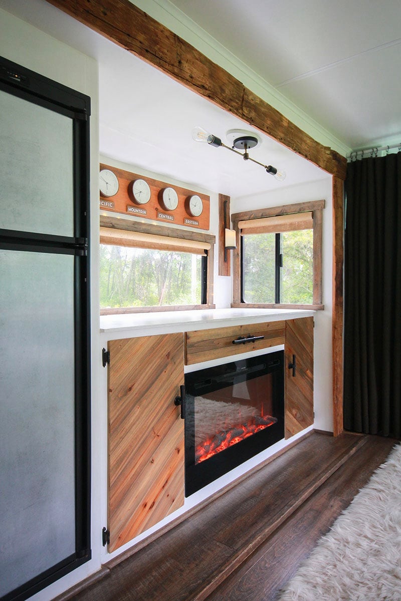 Rustic RV with hand-hewn barnwood around slide-out