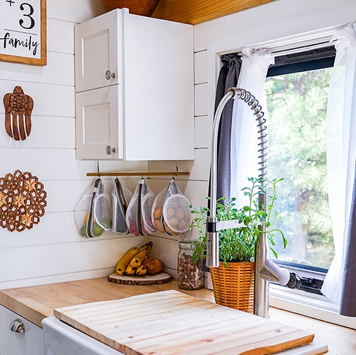 Modern farmhouse Kitchen inside converted school bus designed by @happyhomebodies