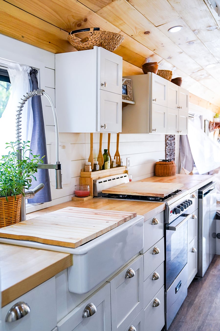 amazing tiny kitchen design inside converted school bus @happyhomebodies