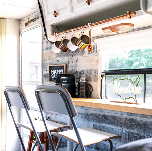 This remodeled travel trailer includes modern country accents and a colorful kitchen