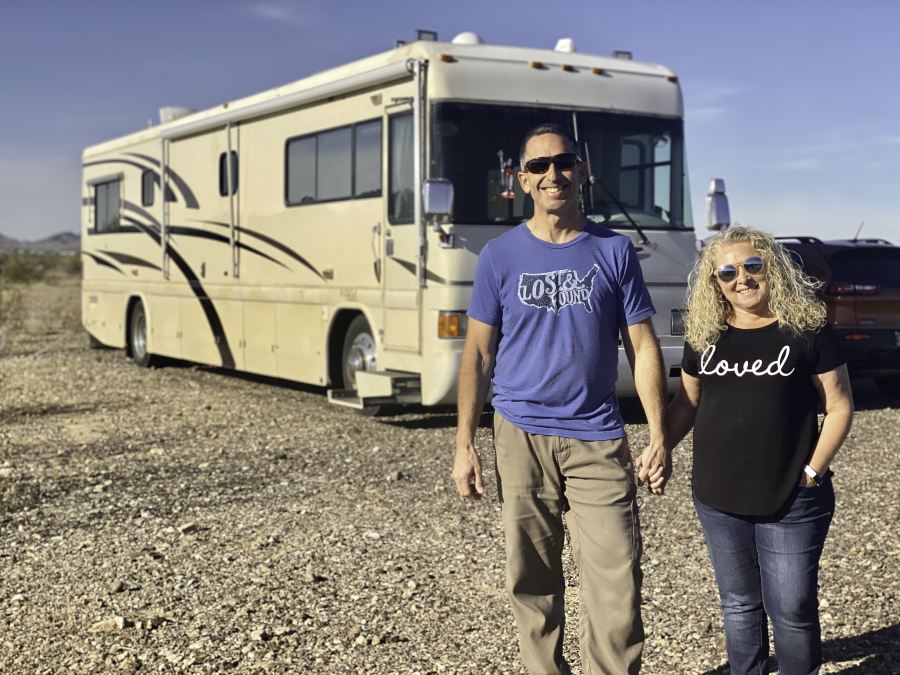 Marc and Julie of RVLove in front of their renovated RV