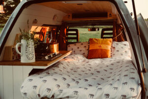 cozy bedroom inside tiny van