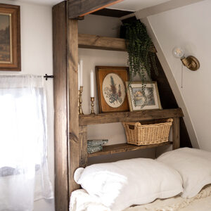 cozy vintage-inspired bed nook inside camper