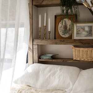 cozy vintage-inspired bed nook in camper