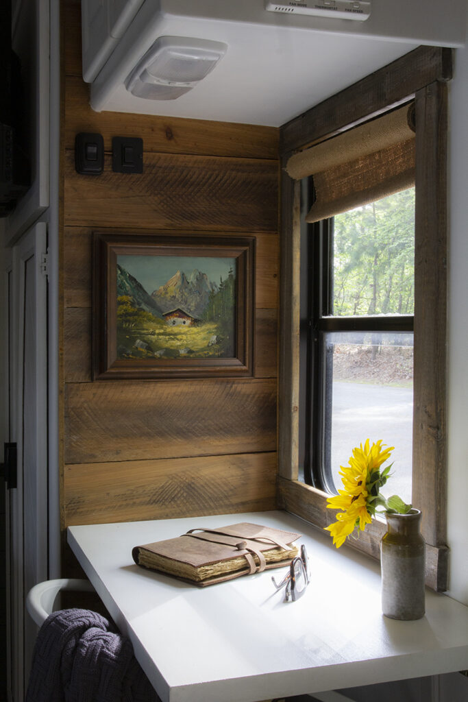 cozy rustic desk nook with cabin oil painting