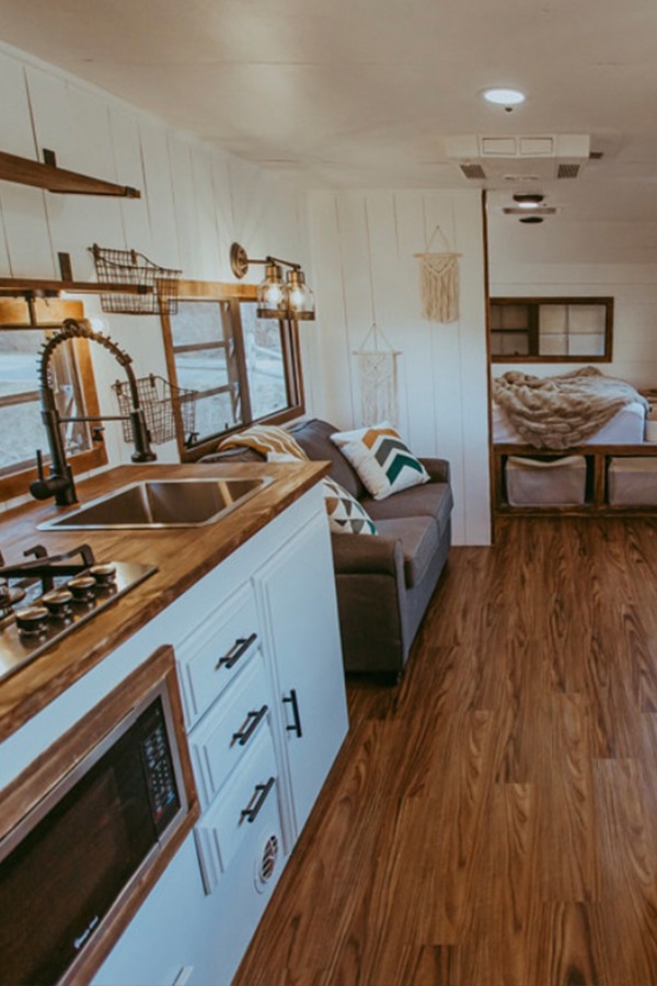 Tour this family-friendly camper remodel that includes a DIY epoxy shower