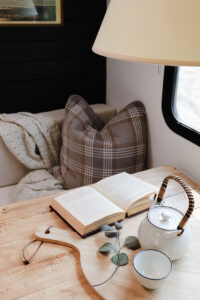 plaid pillow inside cozy camper